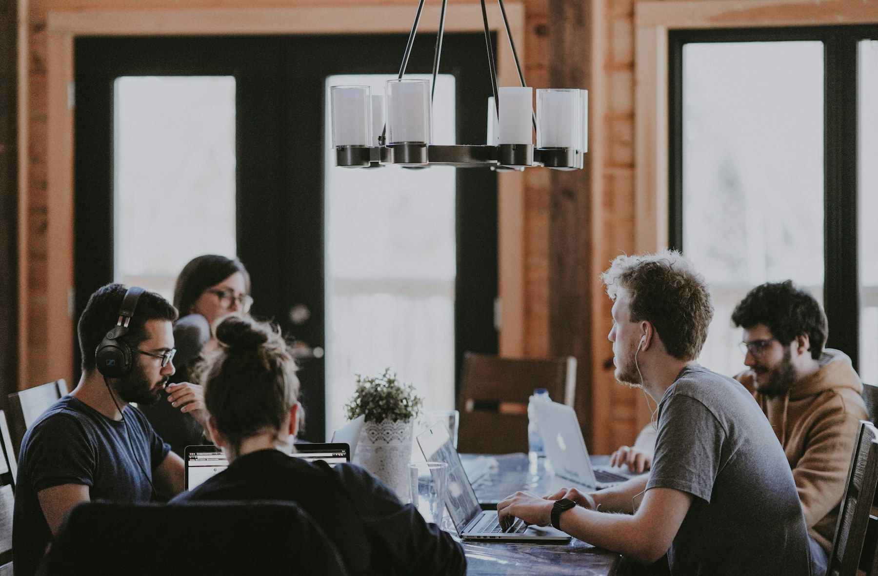 A team working together around a shared table in a bright office
