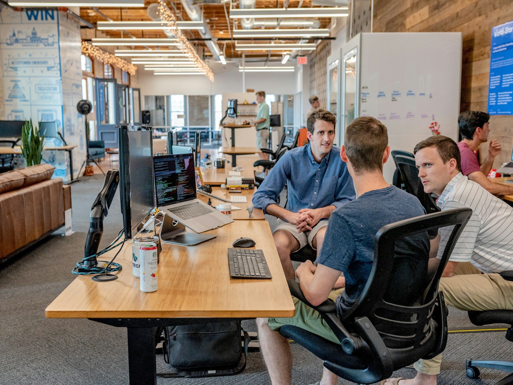 A team working together in a busy open-plan office