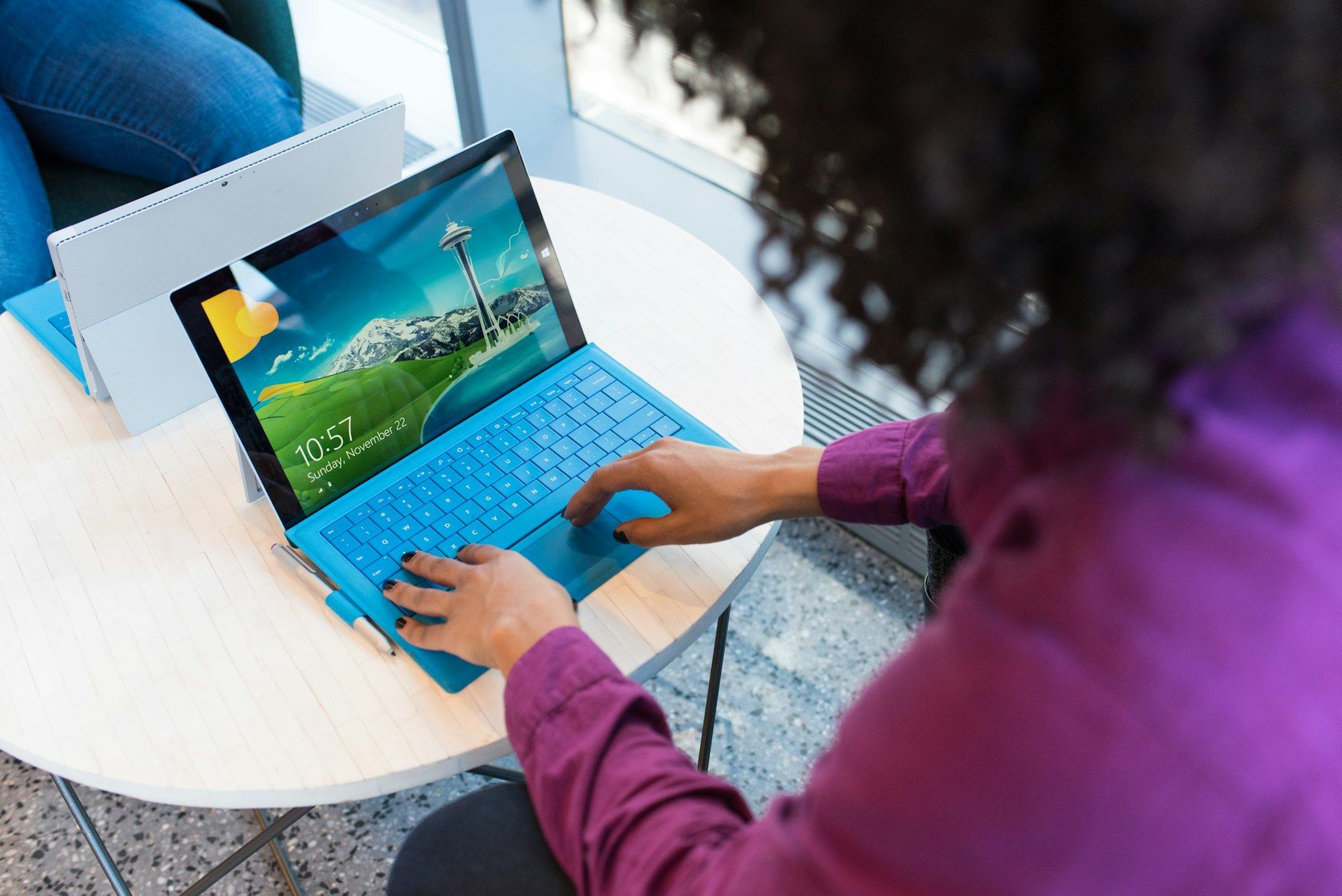 A professional working on a tablet at a desk